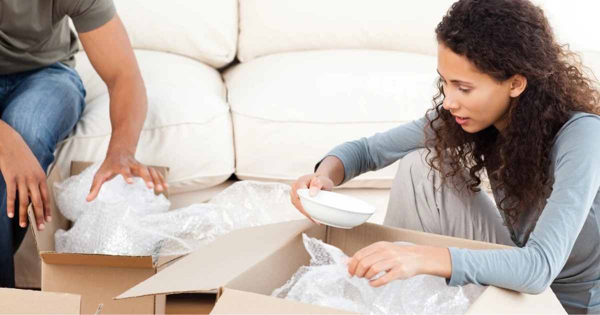 Stress-free moving unpacking: Caring professionals handle fragile items with precision and care.